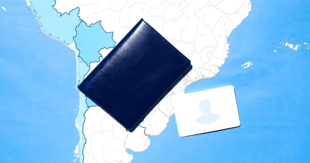 Passaporte e cartão de residência sobre mapa da América do Sul, tema residência no Paraguai para brasileiros